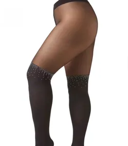Detail of sheer black tights featuring rhinestone embellishments and a faux thigh-high look