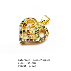 Detail of 16x17mm gold copper heart pendant with multicolor zircon inlay and specs