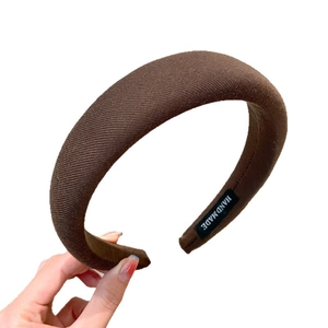 Brown knitted thick headband with handmade label for elegant high cranial top styling