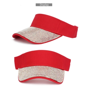 Detailed views of red visor cap with sparkling rhinestones and breathable fabric