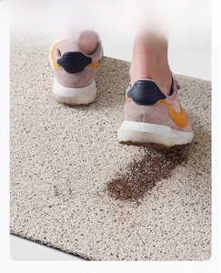 Close-up of cream PVC coil mat showing durable texture and dirt-trapping function