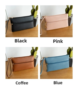Detail view of lychee-textured coin purses in four colors with heart-shaped gold pendants