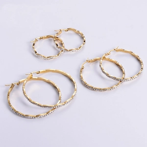 Set of three gold 18K plated stainless steel wave hoop earrings with inlaid zircons