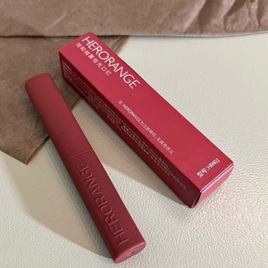 Matte velvet finish red lipstick with matching packaging box in a stylish still life view