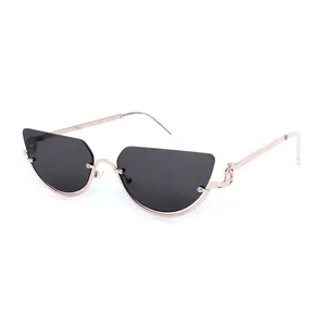 Retro cat-eye semi-rimless sunglasses with rose gold metal frames and Y2K hollow temple detail