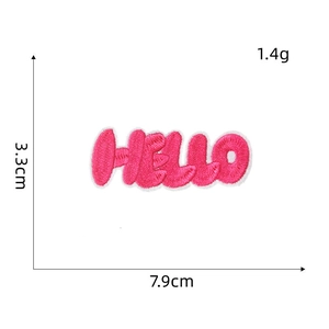 Detailed view of pink embroidered HELLO patch with size measurement 3.3x7.9cm