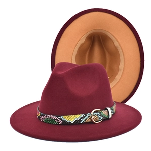 Detail of burgundy fedora with camel interior and snakeskin band with gold buckle