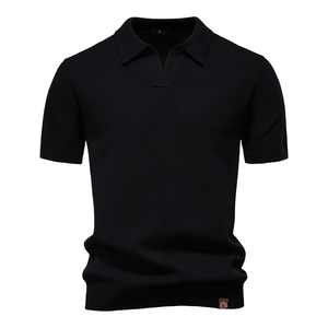 Macro shot of black pineapple knit texture and collar detail on men's short sleeve polo shirt
