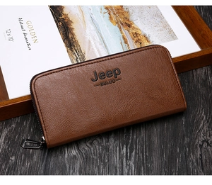 Brown leather long wallet with zipper detail and embossed logo on wood surface