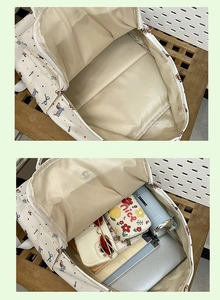 Internal view of the white dog print backpack showing spacious storage capacity