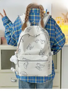 Close-up of white butterfly print backpack with plush cloud charm and gray shoulder straps