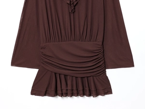 Detailed view of chocolate brown ruched V-neck dress with ruffled hem and sheer fabric