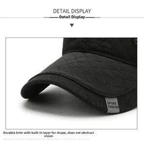 Close-up of quilted winter baseball cap brim with Sport Fashion label and fine stitching