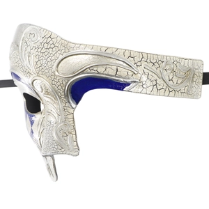Detail of silver Venetian mask with cracked texture and blue painted filigree accents