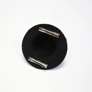 Detail of mini black felt top hat hair accessory with two secure silver metal clips
