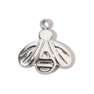 Macro detail of silver stainless steel bee pendant with a polished metallic finish