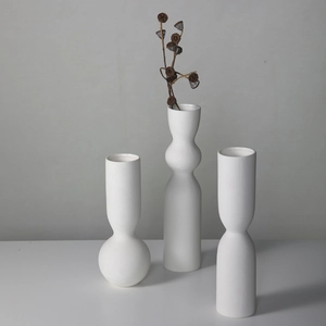 Minimalist white ceramic vases with ribbed texture for modern home decor and dried flowers