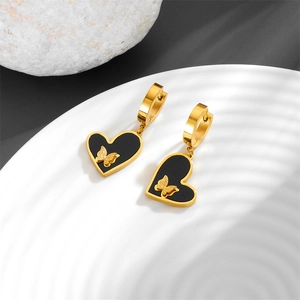 Elegant gold titanium steel earrings with black heart charms and butterfly detail