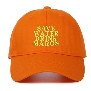 Detail of neon green embroidery SAVE WATER DRINK MARGS on orange cotton baseball cap