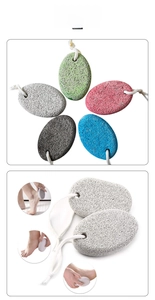 Macro detail of multi-color volcanic pumice stones showing porous texture and hanging ropes