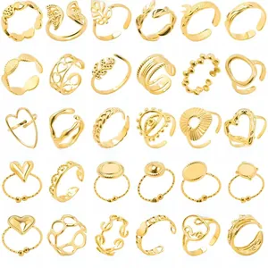 Grid display showing 30 distinct gold adjustable stainless steel rings in various styles