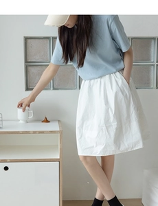 Close-up of black vertical striped mesh cotton socks worn by a model in a casual outfit