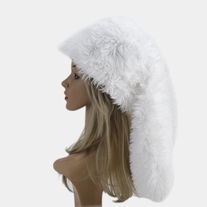 Close-up of white long plush winter hat with trailing tail design on a mannequin