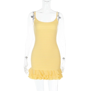 Close-up of bright yellow bodycon mini dress showing tiered ruffle hem and knit texture