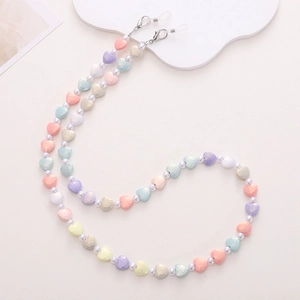 Detail of multi-color heart beads and pearls on a glasses chain with metal lobster clasps