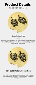Detail of 18K gold black hollow skull earrings with sparkling rhinestone eye accents