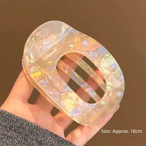Detail view of 10cm opalescent acetate hair clip showing the holographic material