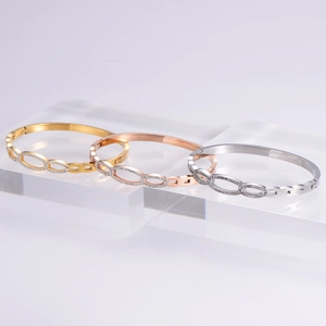 Three-color linked star bangles in gold, rose gold and silver with micro-pave zircons
