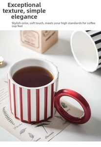 Macro detail of a wavy-edge ceramic coffee mug with red and white stripes and round handle