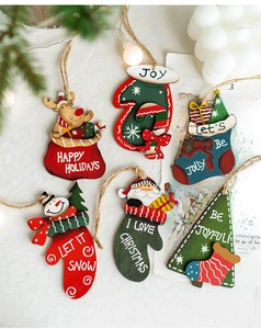 Detailed view of a 6-piece wooden Christmas ornament set including Santa and snowman