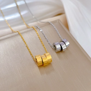 Minimalist titanium steel Roman numeral ring necklaces in gold and silver finishes