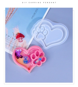 Detailed view of heart-shaped cat paw silicone mold for DIY resin earring pendants