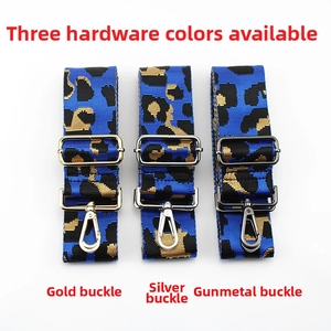 Detailed view of leopard print bag straps featuring adjustable metal hardware buckles