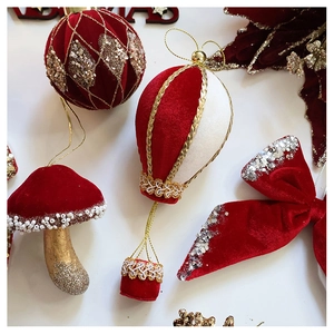 Detailed view of velvet Christmas ornaments including hot air balloon and mushroom shapes