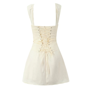 Detail view of the lace-up back design on a cream off-shoulder mini summer dress