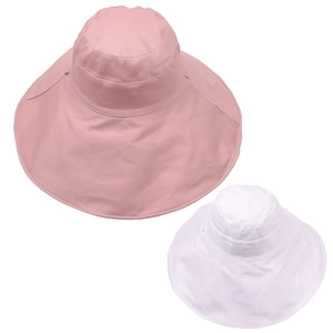 Flat lay of pink and white wide brim sun hats for women with cotton canvas fabric