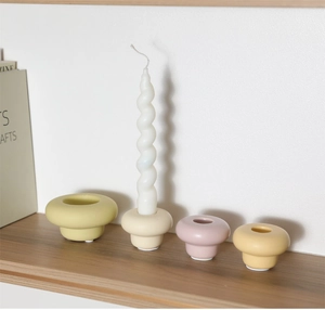Detailed view of mushroom ceramic candle holders in Morandi tones with non-slip pads