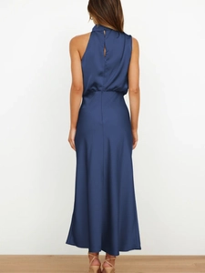 Elegant navy blue satin maxi dress with halter neck and backless design for evening wear