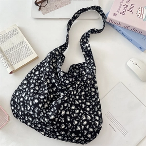 Detail of vintage leopard print heart pattern canvas bag with books and daily essentials