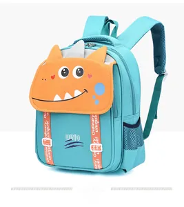 Detail view of the breathable mesh side pocket and orange dinosaur spine on blue kids backpack