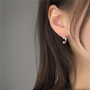 Minimalist 925 sterling silver U-shaped hoop earring and ball stud set on model