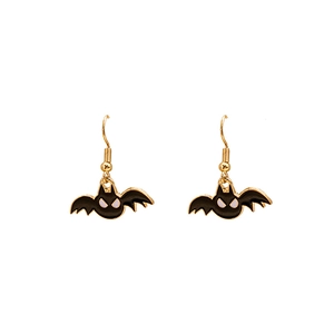Detailed close-up of bat earrings with black enamel and gold metallic finish
