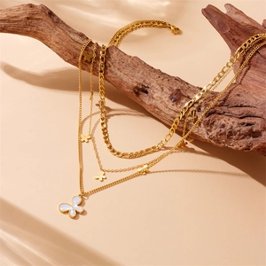 Layered gold-plated stainless steel necklace with white shell butterfly pendants