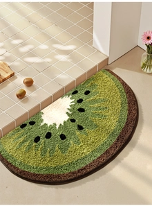 Detail of soft semi-circular kiwi fruit bath mat with plush non-slip absorbent texture