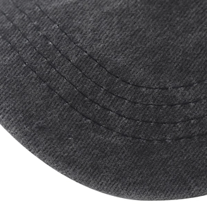 Detailed macro view of the dark grey washed cotton baseball cap brim with stitching