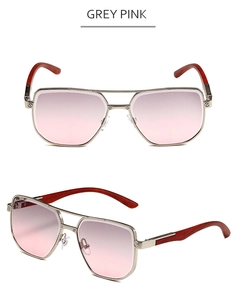Detail of pink gradient lenses and wood texture temples on metal aviator sunglasses